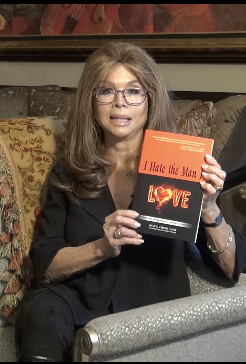 Joan E. Childs Holds Book I HATE THE MAN I LOVE: A Conscious Relationship is Your Key to Success