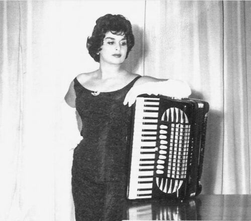 Joan E. Childs with accordion