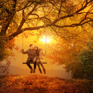 Romantic couple swing in the autumn park